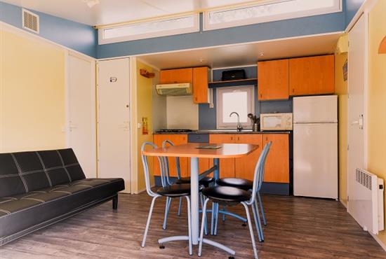 Living room/Open kitchen - Camping de Bernezac